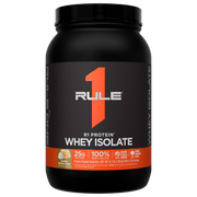 Black container of R1 Protein Whey Isolate with vanilla butter cake flavor label Orange graphic and text