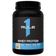 Front of black tub of protein powder with a blue label for Whey Protein and Vanilla Ice Cream flavor